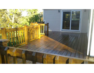 pressure-treated pine deck with dark oak tone sealer PT | L2 | Dark Oak